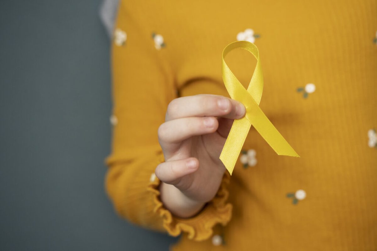 child-holding-yellow-ribbon-1024x683-1