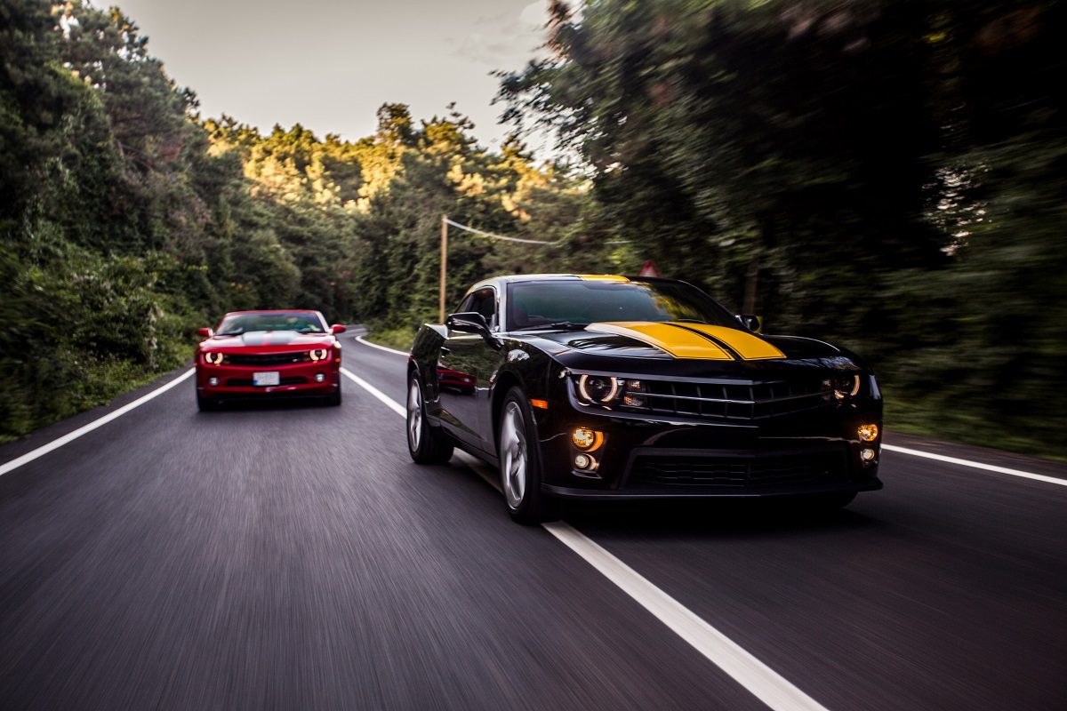 red-and-black-sport-cars-racing-on-the-highway-1